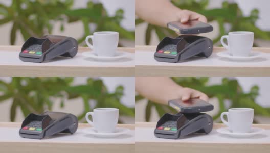 用手机付款。2019冠状病毒病大流行期间，小咖啡店采用NFC技术的非接触式支付。社交距离可以让曲线变平。高清在线视频素材下载