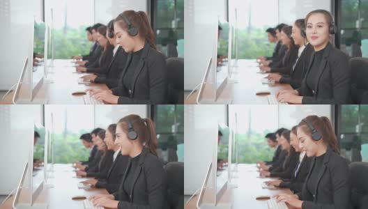 亚洲呼叫中心的女性与不同种族的员工在运营监控室接触或与客户概念交谈高清在线视频素材下载