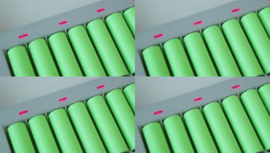 充电器里有很多绿色的锂离子电池。滑翔视图高清在线视频素材下载