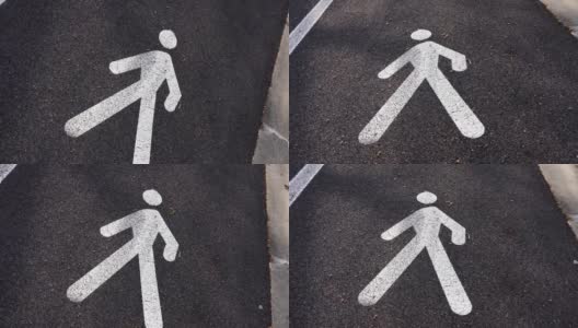 在柏油路白色步行街标志上移动高清在线视频素材下载