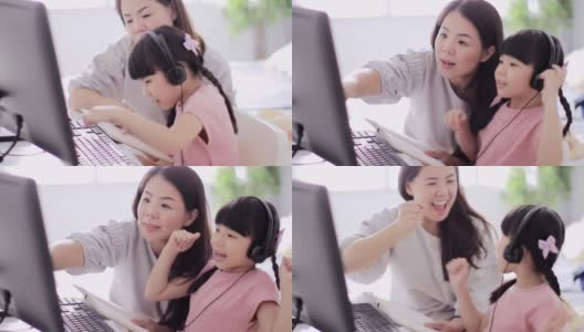 亚洲母亲和女儿练习在家学习高清在线视频素材下载
