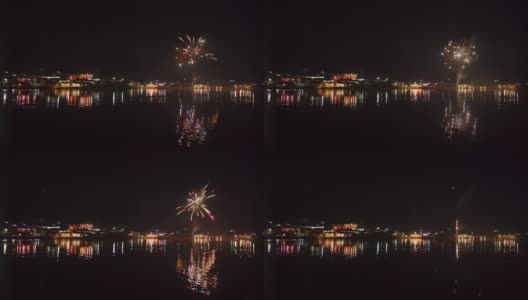 风景秀丽的自然景观，河流湖泊与五颜六色的真正的新年焰火闪烁与散景灯在夜空中高清在线视频素材下载