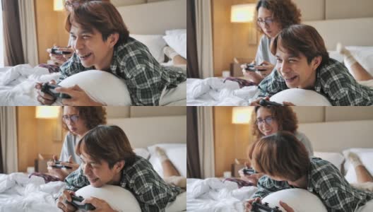 两个青少年在他们的房间里玩电子游戏。高清在线视频素材下载