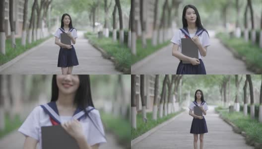 年轻的亚洲女人拿着笔记本电脑高清在线视频素材下载