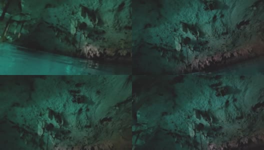 在墨西哥图卢姆，在“大天然井”天然石灰石池的洞穴中与飞翔的蝙蝠一起潜水高清在线视频素材下载