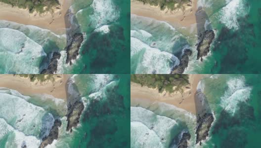 无人机飞过澳大利亚新南威尔士州Narooma海滩的Glasshouse Rocks高清在线视频素材下载
