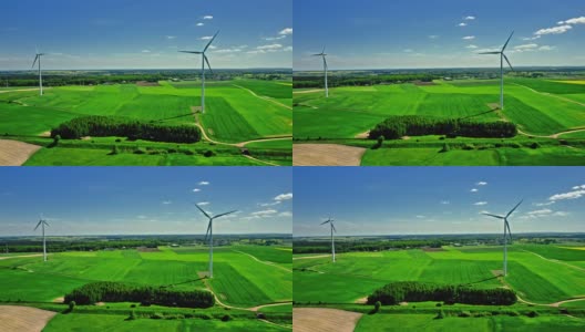 风力发电机和农村油菜籽田。高清在线视频素材下载