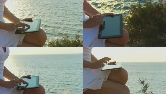 HD CRANE:在海边使用平板电脑的女人高清在线视频素材下载