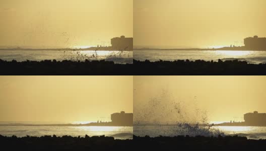 日出时海浪撞击岩石高清在线视频素材下载