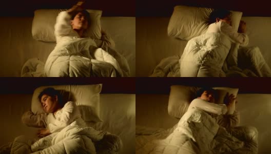 一名抑郁的女子因失眠躺在床上的镜头，快速移动高清在线视频素材下载