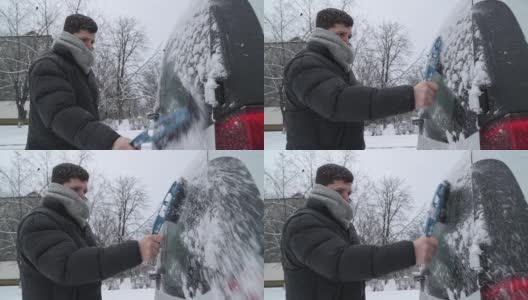 一场大雪过后，司机把车上的积雪清理干净。高清在线视频素材下载