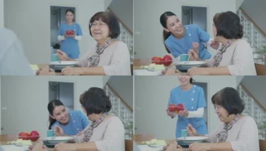 迷人的年轻老年亚洲公民夫妇幸福的坐在餐桌上，聊天，吃汤的健康营养早餐餐在日常生活方式在老亚洲护理居家护理。高清在线视频素材下载