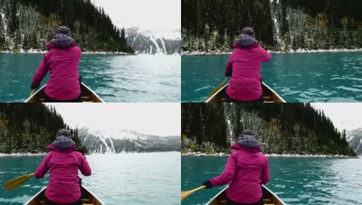 女性冒险家皮划艇高山湖泊高清在线视频素材下载