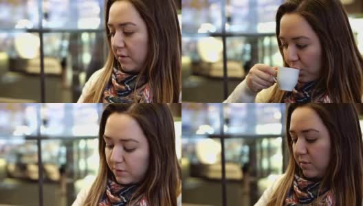 在咖啡馆喝土耳其咖啡的女人高清在线视频素材下载