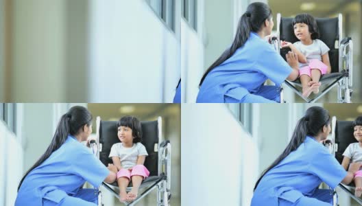 少数民族女护士安抚幼童病人高清在线视频素材下载