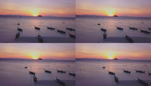 鸟瞰图的热带海滩，长尾船，皮划艇和岩石海岸与水晶清澈的绿松石水，泰国，沙顿高清在线视频素材下载