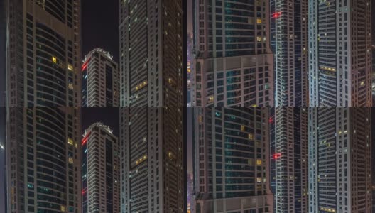 美丽的摩天大楼的窗户在晚上的时间流逝高清在线视频素材下载