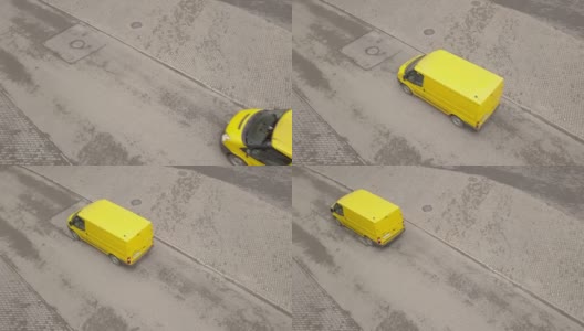 黄色小巴沿柏油路行驶。黄色客货车在路上行驶高清在线视频素材下载