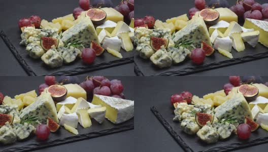 羊奶干酪，布里干酪，帕尔马干酪和水果的视频高清在线视频素材下载