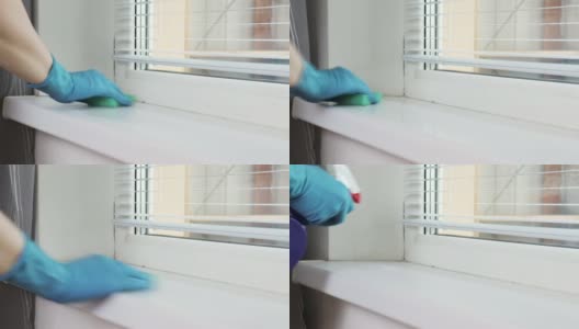 用卫生喷雾剂和海绵，戴着蓝色橡胶手套，用妇女的手清洁洗涤窗台高清在线视频素材下载