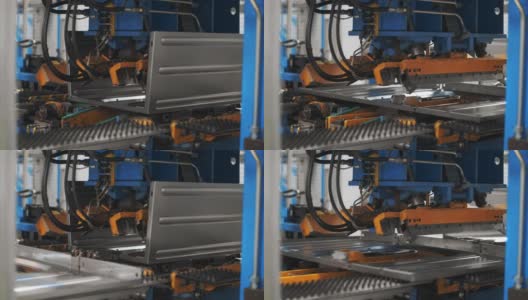 从工厂的金属零件组装洗衣机的机器人设备高清在线视频素材下载