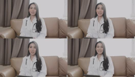 亚洲女医生通过视频聊天在线咨询病人，远程保健和远程医疗的概念高清在线视频素材下载