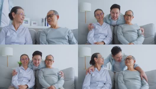 亚洲老夫妇的肖像与成熟的儿子坐在客厅里。慈祥的老父母喜欢和英俊的年轻人呆在家里，微笑着看着镜头。家庭关系高清在线视频素材下载