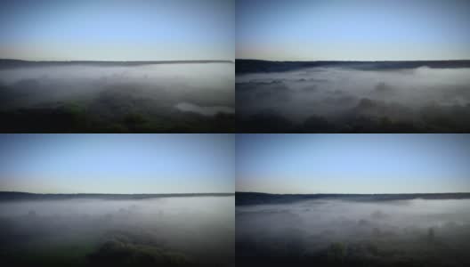 鸟瞰被雾包围的清晨景色高清在线视频素材下载