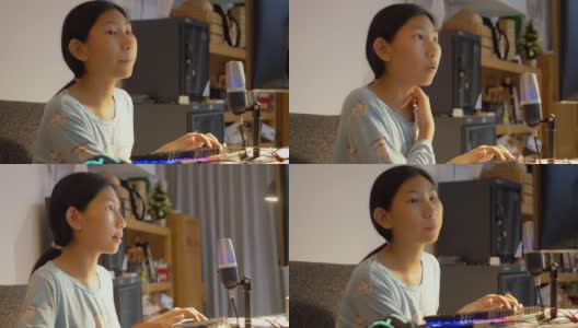 亚洲女孩晚上在家玩网络游戏直播，新潮的生活方式为新一代概念。高清在线视频素材下载