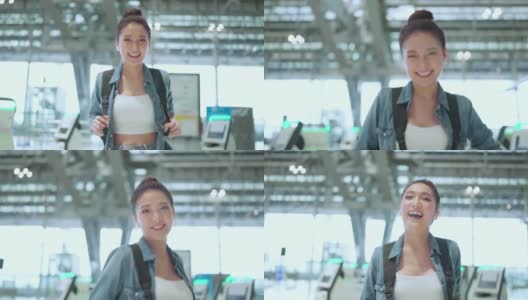 封城结束后，幸福女性再次享受旅行，年轻的亚洲女性在机场候机楼用清新爽朗的背包休闲布微笑着挥手欢迎旅行理念高清在线视频素材下载