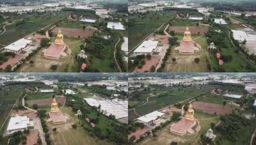 从无人机上鸟瞰为庆祝清莱古城建城750周年而建造的普塔蒙松(佛教公园)的大金佛雕像。高清在线视频素材下载