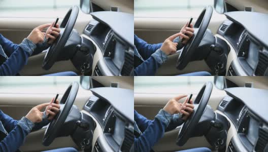 女司机开车时用手机高清在线视频素材下载