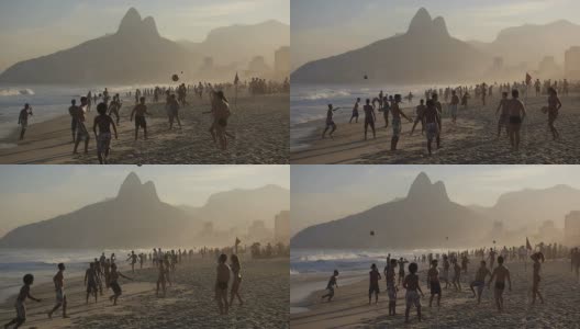 巴西，里约热内卢，日落时分，当地人在著名的依帕内玛海滩打球高清在线视频素材下载