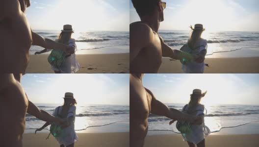 美丽的女孩牵着男人的手跑向海边的水。跟着我拍的快乐女人拉着男朋友去海边。年轻夫妇一起度过暑假。慢镜头观点高清在线视频素材下载