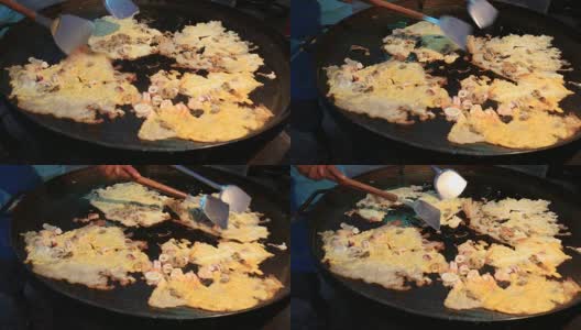 在泰国的街头市场上做炸贻贝煎饼或蚵仔煎高清在线视频素材下载
