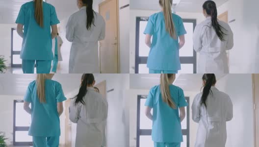 在医院，护士和医生走过走廊的背影照片。医院工作人员。高清在线视频素材下载