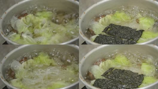 用水煮白菜汤，加上面条和海藻高清在线视频素材下载