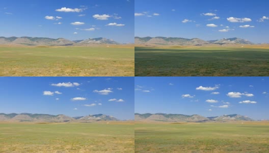 蓝天背景下的草原和丘陵景观高清在线视频素材下载