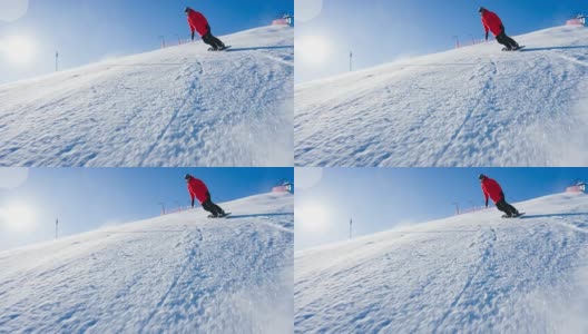 滑雪者从滑雪坡上冲下来，雪花向他喷来高清在线视频素材下载