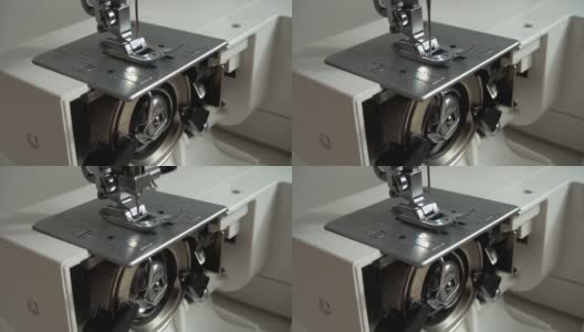 缝纫机的针可以做线迹。缓慢的运动。缝纫机的工作原理。缝纫机的内部部件。高清在线视频素材下载