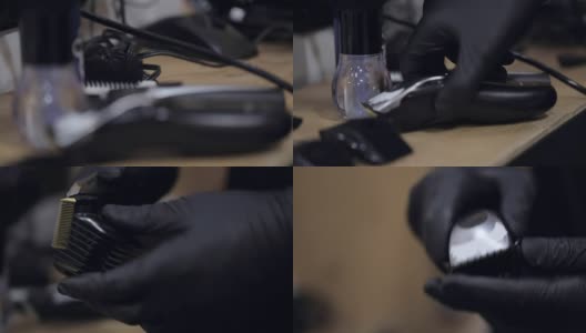 理发师在黑手套从一个完整的工具板上拿电动剃须刀和梳子。高清在线视频素材下载