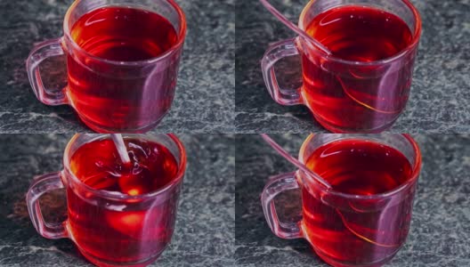 茶包浸泡在一杯茶和不锈钢匙混合特写高清在线视频素材下载
