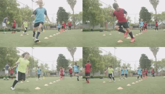 坚定的男孩和女孩在球场上练习足球高清在线视频素材下载
