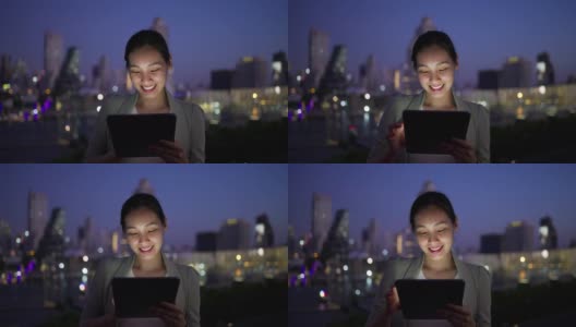 在城市之夜使用智能手机的女商人高清在线视频素材下载