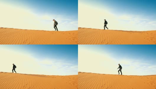 男游客走在沙漠上高清在线视频素材下载