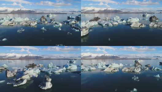 4K空中电影飞越冰川碎片泻湖，冰岛Jokulsarlon高清在线视频素材下载