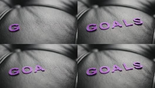 字母“GOALS”出现在黑色皮革上高清在线视频素材下载