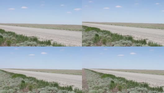 在俄罗斯卡尔梅克共和国，汽车在草原上行驶的一条废弃的道路高清在线视频素材下载