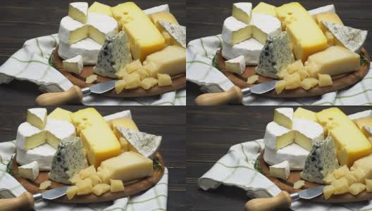 各种奶酪的视频-帕尔马干酪，布里干酪，切达干酪和羊乳干酪高清在线视频素材下载