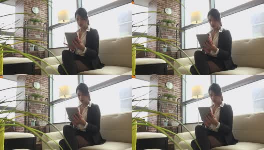 韩国女经理女商人在酒店用Ipad平板电脑高清在线视频素材下载